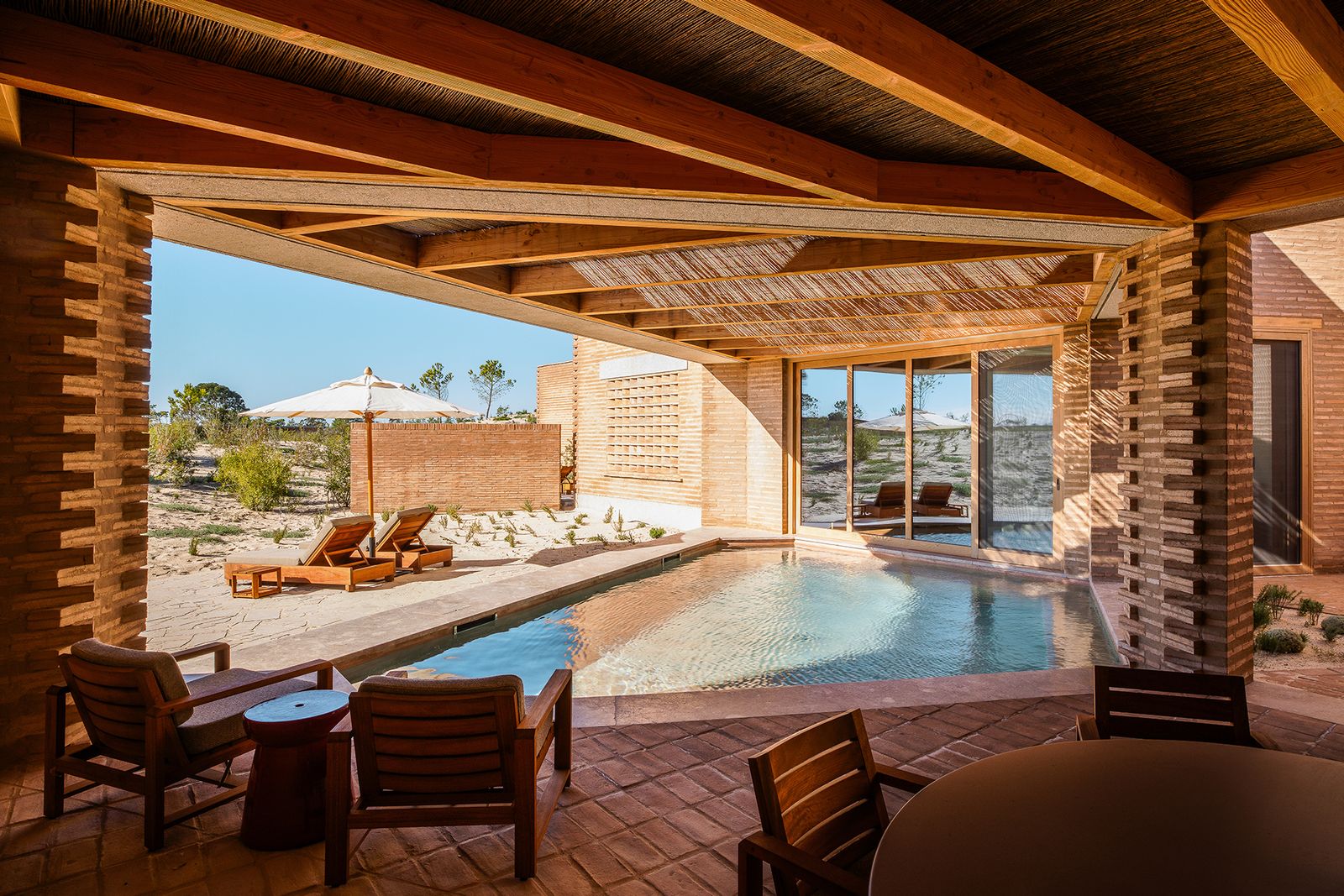 Image may contain Indoors Interior Design Pool Water Swimming Pool Architecture Building Hotel Resort and House