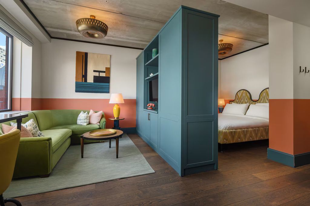 Image may contain Indoors Interior Design Furniture Home Decor Closet Cupboard and Lamp