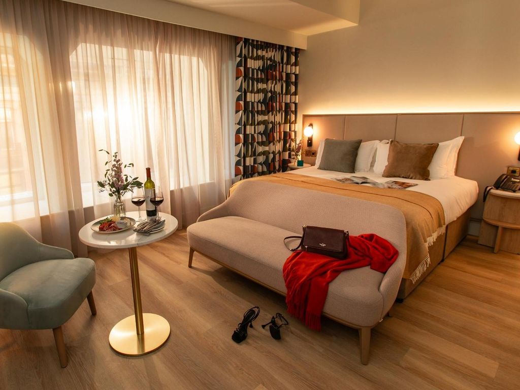 Image may contain Accessories Bag Handbag Chair Furniture Clothing Footwear High Heel Shoe Lamp and Home Decor